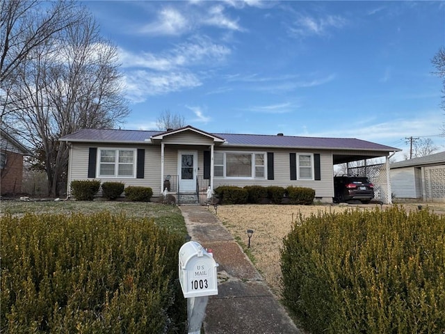 ranch-style house featuring crawl space, metal roof, and an attached carport