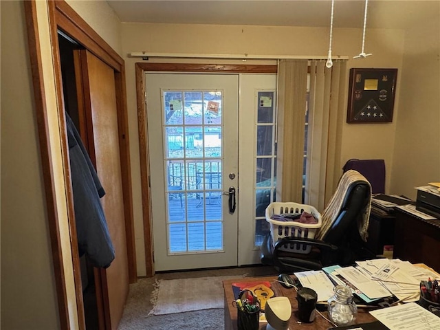 doorway to outside with carpet