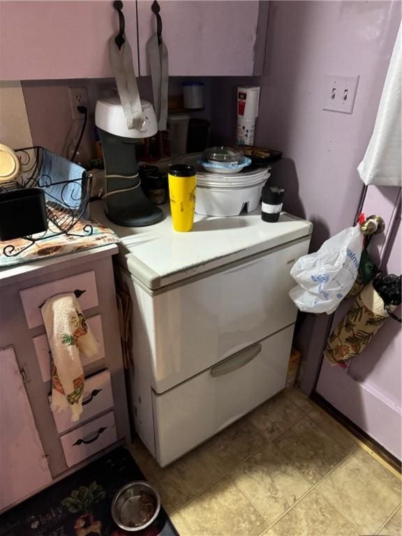 kitchen with light tile patterned floors