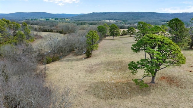 exterior space with a rural view and a mountain view