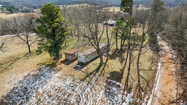 drone / aerial view featuring a wooded view