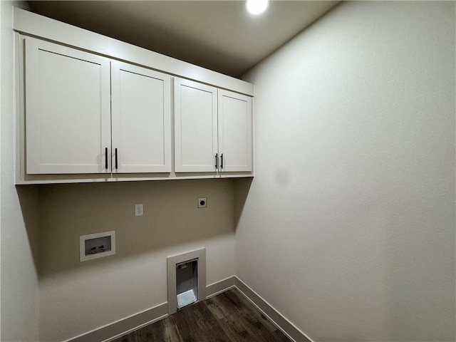 clothes washing area with hookup for a washing machine, baseboards, cabinet space, dark wood finished floors, and electric dryer hookup