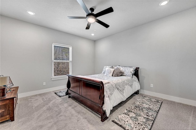 bedroom featuring recessed lighting, baseboards, and light carpet