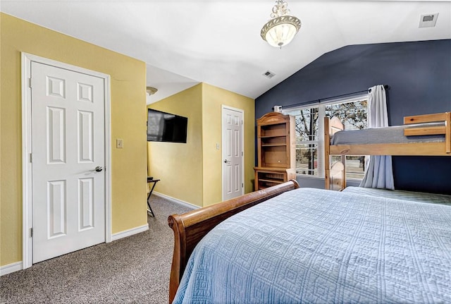 bedroom with carpet floors, baseboards, visible vents, and vaulted ceiling