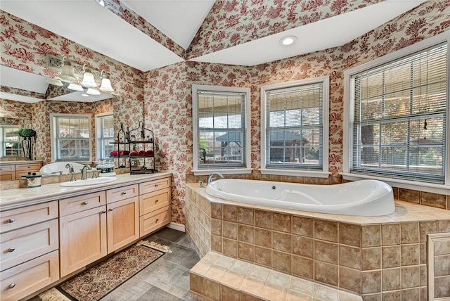 full bath featuring wallpapered walls, vaulted ceiling, vanity, tile patterned flooring, and a bath