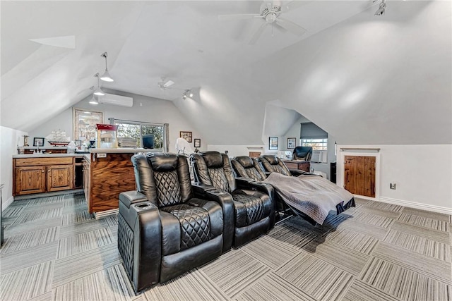 home theater room featuring vaulted ceiling, carpet floors, a ceiling fan, and baseboards