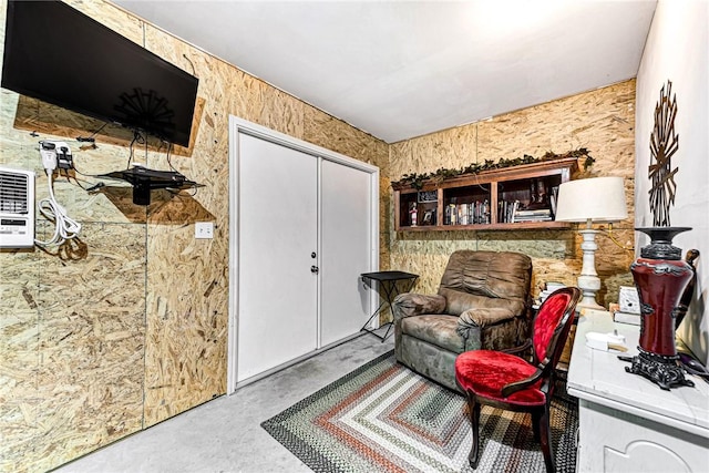 living area featuring concrete flooring