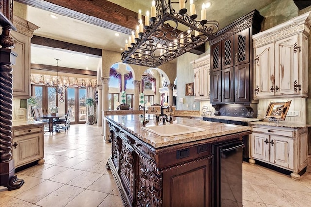 2 S Samoset Ct, Rogers, AR 72758 - kitchen featuring a chandelier, decorative backsplash, light stone counters, and pendant lighting