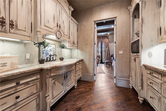 2 S Samoset Ct, Rogers, AR 72758 - kitchen featuring dark wood-style floors, light stone countertops, and black microwave