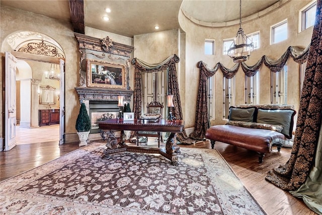 2 S Samoset Ct, Rogers, AR 72758 - office area featuring a high ceiling, a fireplace, and hardwood / wood-style floors