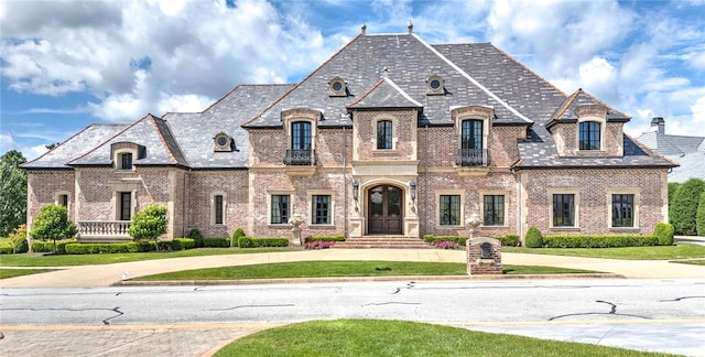 2 S Samoset Ct, Rogers, AR 72758 - french provincial home with a high end roof, brick siding, and a front yard