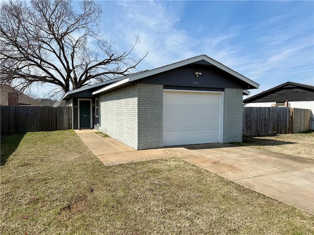 detached garage with driveway and fence