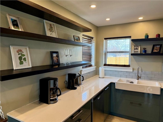 bar with dishwasher, a sink, and recessed lighting