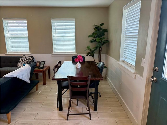 dining area featuring a wainscoted wall