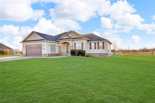 view of front of home with a garage, concrete driveway, and a front lawn