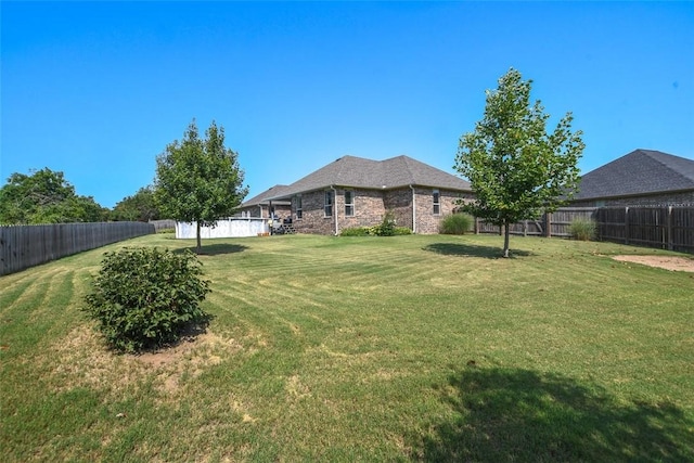 view of yard featuring a fenced backyard