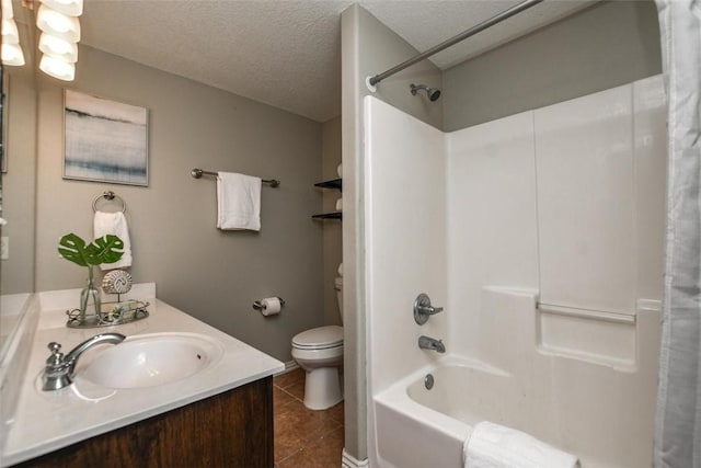 bathroom with shower / bath combo, toilet, tile patterned floors, a textured ceiling, and vanity