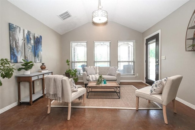 sitting room with lofted ceiling, baseboards, and visible vents