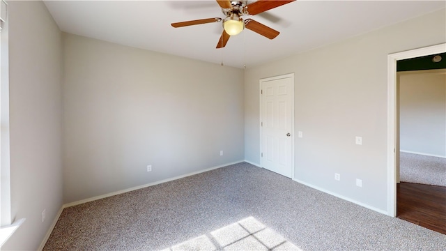 unfurnished bedroom featuring a ceiling fan, carpet flooring, and baseboards