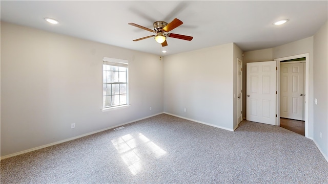 unfurnished bedroom with baseboards, visible vents, ceiling fan, carpet floors, and recessed lighting