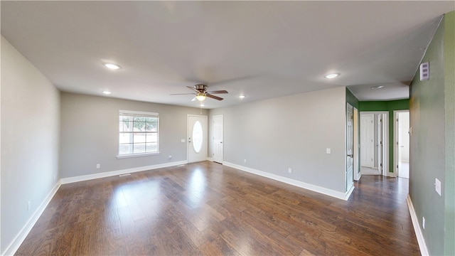 empty room with visible vents, baseboards, a ceiling fan, dark wood-style floors, and recessed lighting