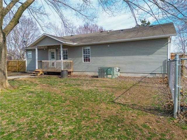 back of house featuring a yard, crawl space, fence, and a wooden deck