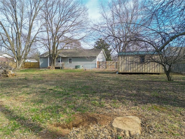 view of yard featuring an outbuilding and a fenced backyard