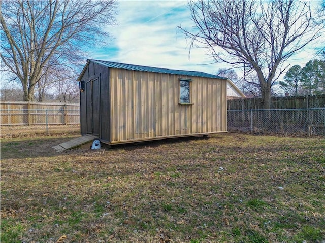 view of shed featuring a fenced backyard