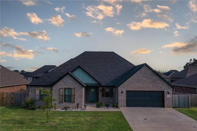 view of front of home with brick siding and a front lawn