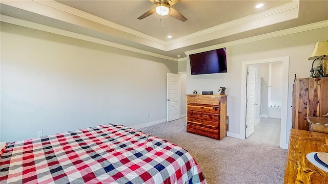 carpeted bedroom featuring ornamental molding, a raised ceiling, and baseboards