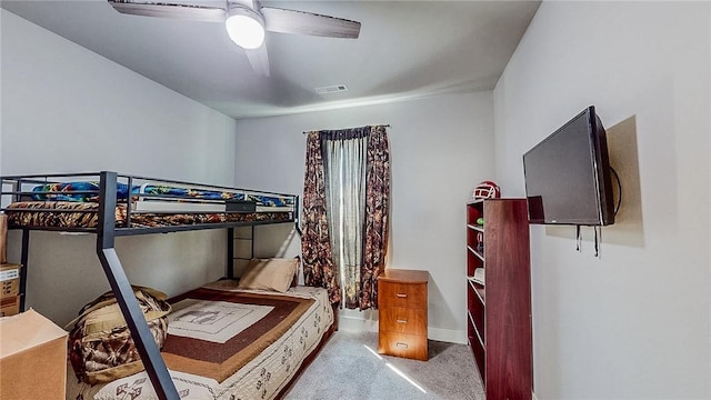 bedroom with carpet floors, ceiling fan, visible vents, and baseboards