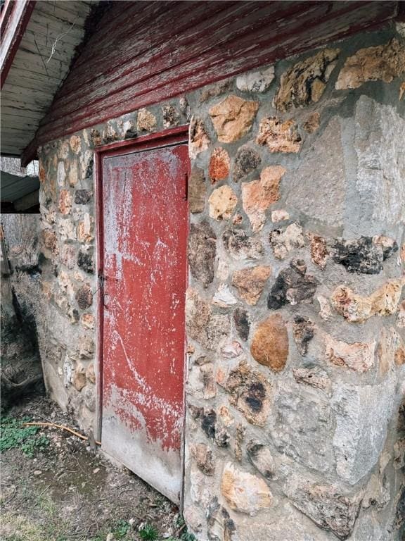 exterior space featuring stone siding