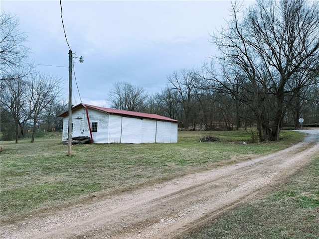 view of road featuring dirt driveway