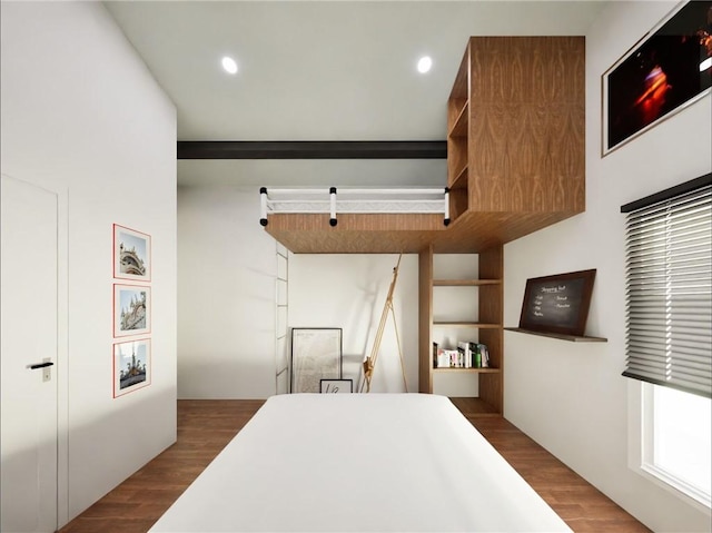 bedroom featuring wood finished floors and recessed lighting