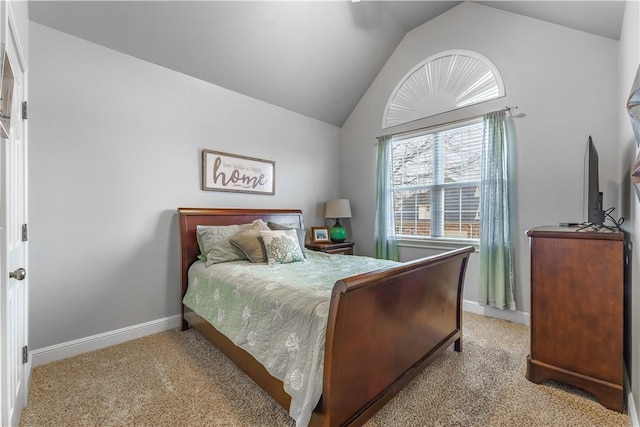 carpeted bedroom with baseboards and lofted ceiling