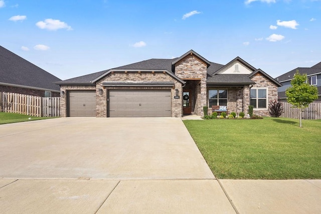 view of front of home with a front lawn, an attached garage, fence, and brick siding