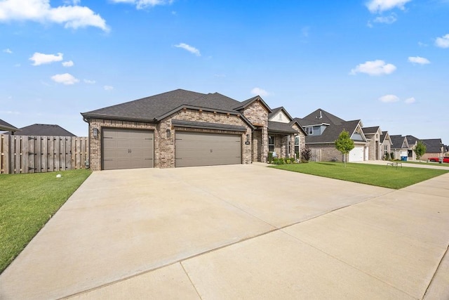 view of front of home featuring fence, a front lawn, concrete driveway, a garage, and brick siding