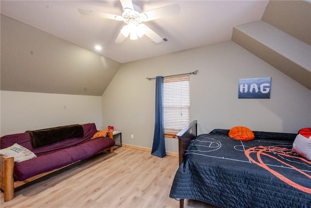 bedroom with lofted ceiling, ceiling fan, wood finished floors, and baseboards