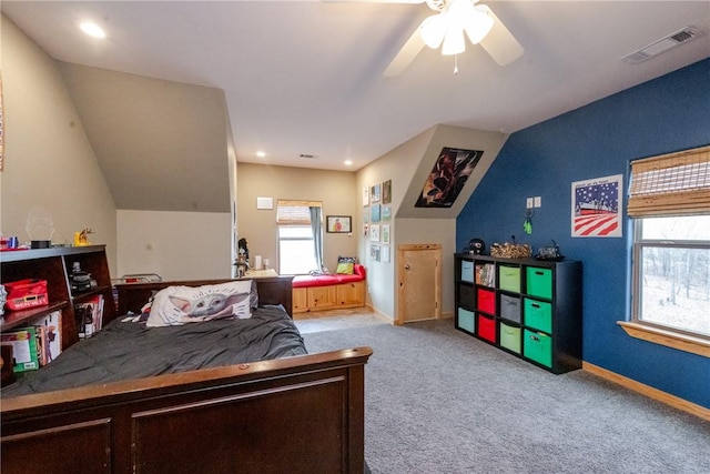 carpeted bedroom featuring baseboards, visible vents, and ceiling fan