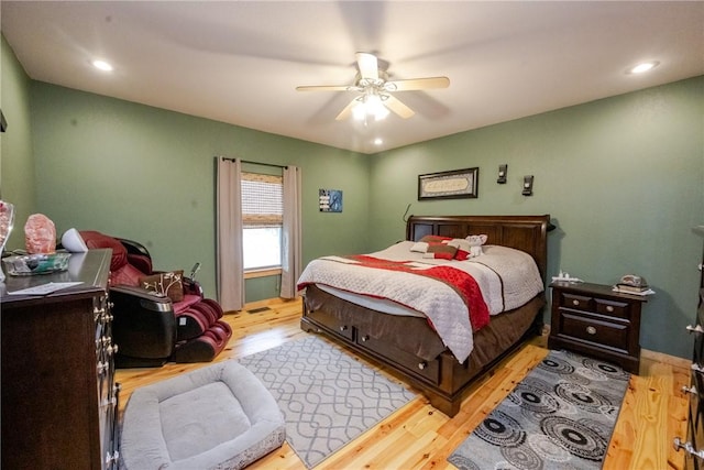 bedroom with light wood-style flooring, ceiling fan, and recessed lighting