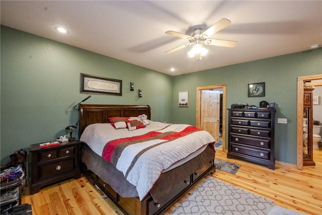 bedroom featuring a ceiling fan, recessed lighting, light wood finished floors, and ensuite bathroom