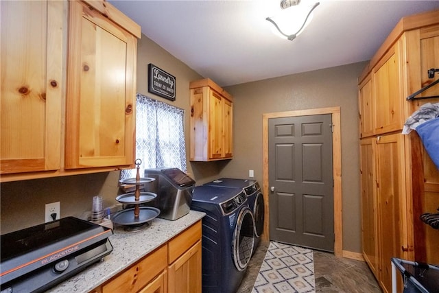 clothes washing area with washer and dryer