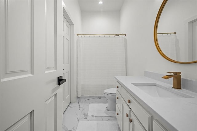 bathroom with toilet, marble finish floor, vanity, and recessed lighting