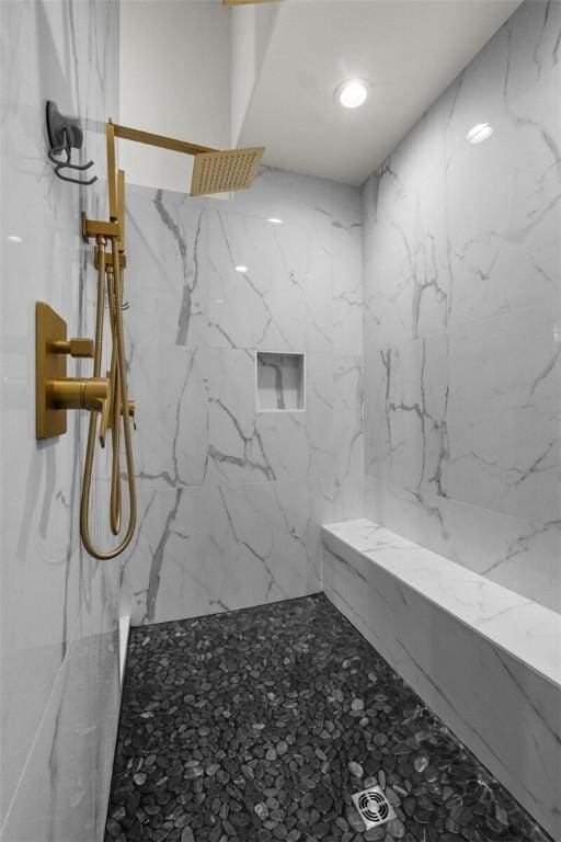 full bath with a marble finish shower