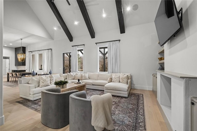 living area with light wood-style floors, recessed lighting, beam ceiling, and high vaulted ceiling