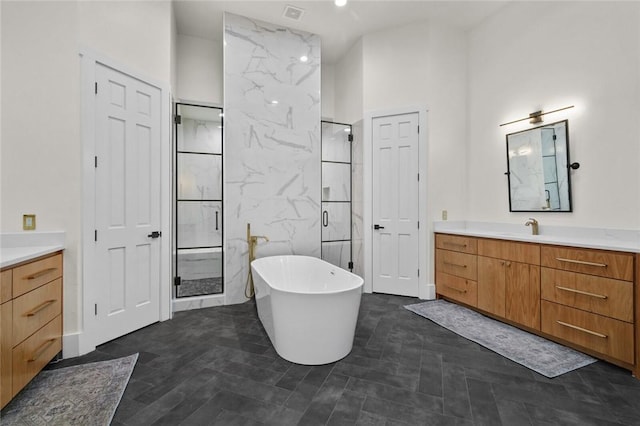 bathroom featuring a soaking tub, a shower stall, tile walls, and vanity