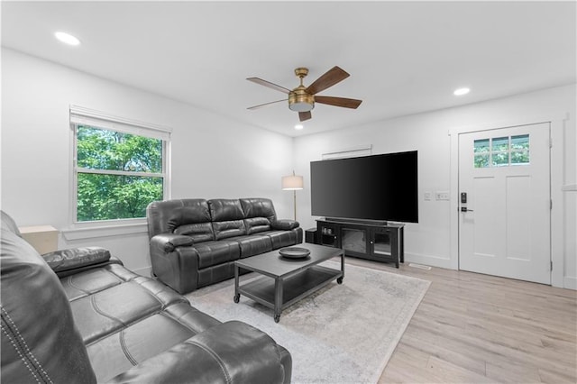 living room featuring ceiling fan, recessed lighting, and light wood-style floors