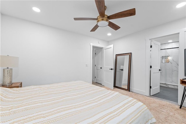 bedroom featuring baseboards, connected bathroom, and recessed lighting