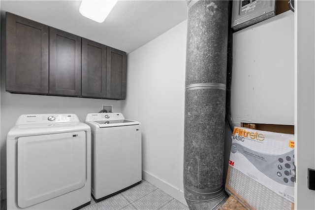 clothes washing area with cabinet space, independent washer and dryer, and baseboards