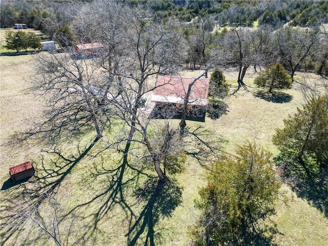 birds eye view of property featuring a wooded view